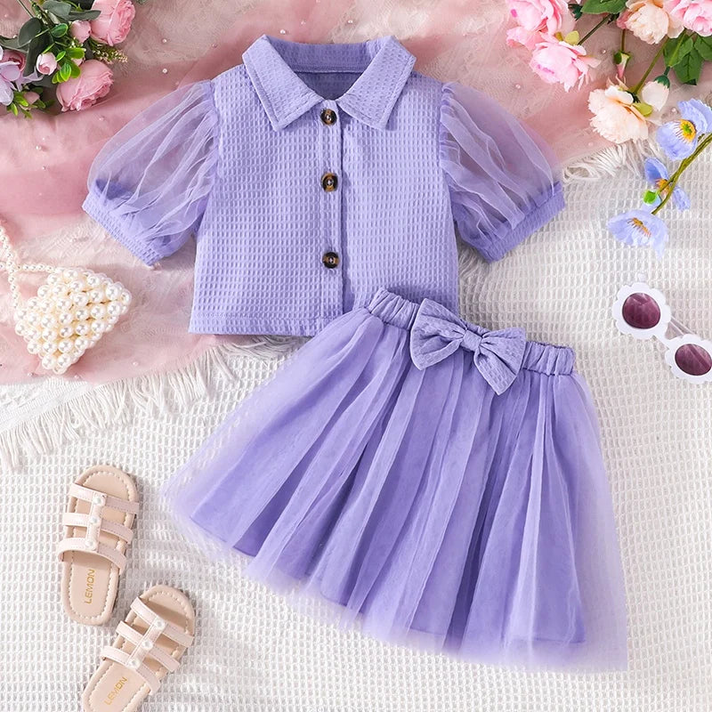 Blusa con botones y manga de encaje Falda de tul morada Traje de verano para niña